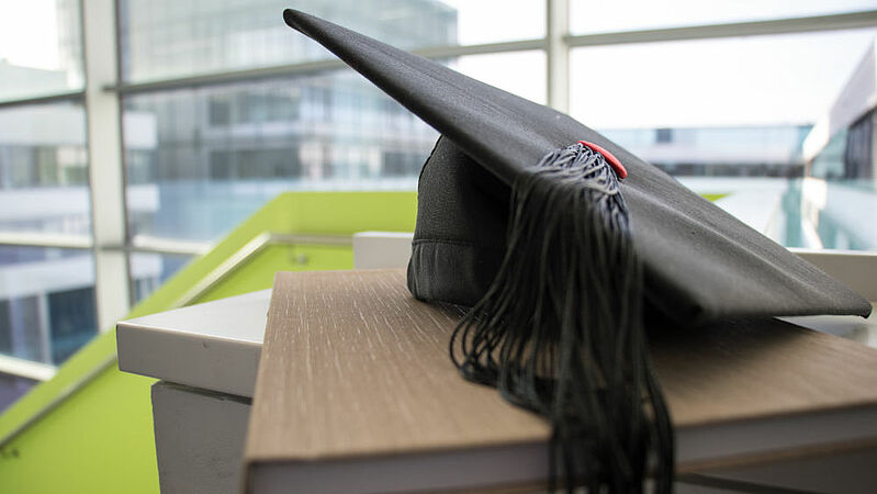 Doctoral hat and a dissertation